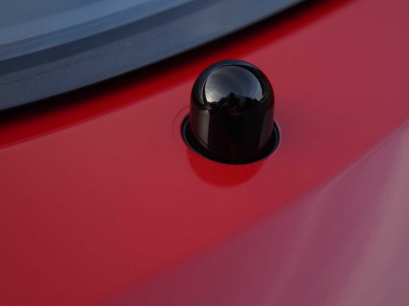 Scheinwerfer Spritzdüsen beim roten Porsche GTS mit Lackschutz-Folierung